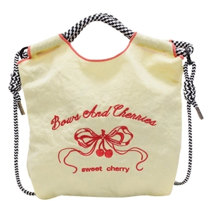 Beige nylon handbag with red butterfly and cherry embroidery on white background