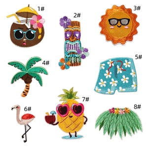 Flat lay detail of eight tropical summer theme embroidered patches with numbered labels