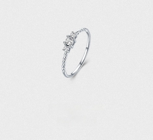 Close-up of S925 silver rope band ring featuring three prong-set cubic zirconia stones