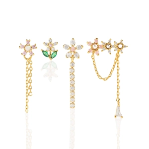 Floral stud earring set with zircons and pearls in golden finish on white backdrop