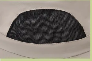 Detail of breathable black mesh vent on beige outdoor sun hat with premium stitching