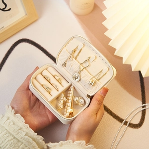Portable white PU leather jewelry travel organizer case with multiple compartments and zipper