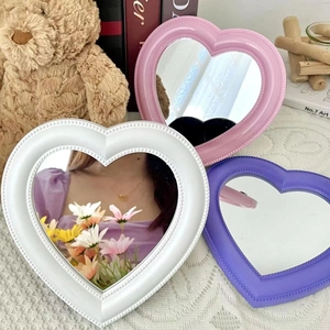 Heart-shaped tabletop makeup mirrors in pink, white and purple with beaded frame design