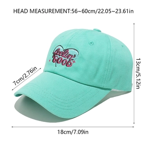 Detailed view of mint green baseball cap dimensions with pink embroidered heart pattern