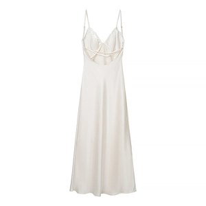 Detailed back view of white silk maxi dress featuring lace trim and criss-cross straps