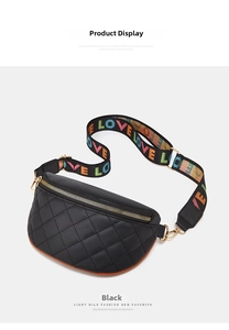 Detail of black quilted fanny pack with colorful LOVE embroidered strap and gold hardware