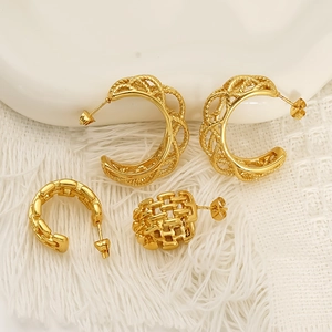 Golden hollow woven C-shape earrings with geometric texture and stainless steel finish