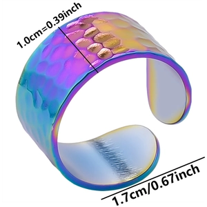 Detail view of 1.0cm wide rainbow stainless steel ring with hammered scale texture