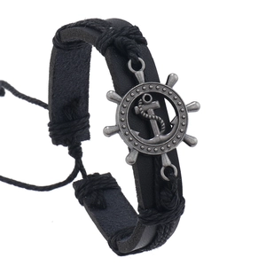 Retro black braided leather bracelet featuring silver ship wheel and anchor charms