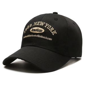 Detail of black baseball cap with vintage New York 1989 embroidery on cotton fabric