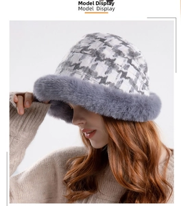Detail view of winter checkerboard bucket hat with plush grey faux fur trim for warmth