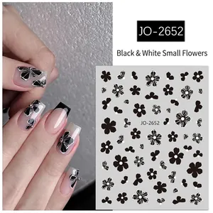 Minimalist black and white floral nail stickers with embossed 5-petal flower designs