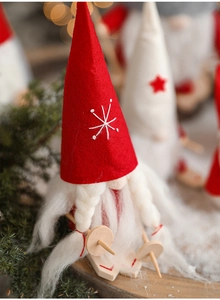 Close-up detail of a Nordic Christmas gnome doll with skiing gear and soft white beard texture
