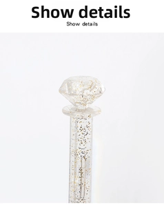 Close-up of a wall-mounted jewelry hook with crystal diamond top and glitter filler
