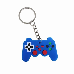 Blue PVC game controller keychain with colorful buttons and silver metal ring on white background