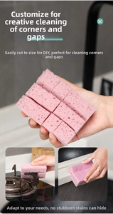 Detail of pink high-density cleaning sponge with porous honeycomb texture and pre-cut design