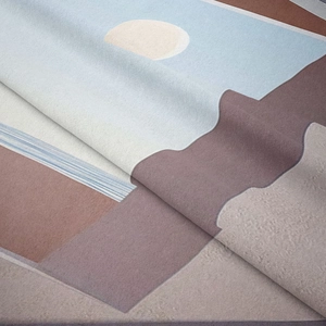 Close-up of thick modern geometric tapestry showing soft texture and abstract sunset pattern
