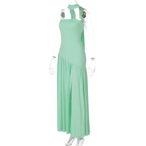Detail view of mint green halter dress featuring slit hem and elegant ribbon accents