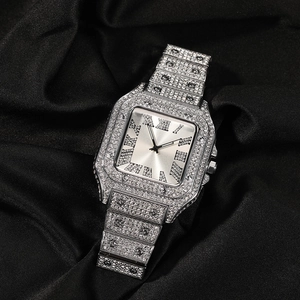 Detail of luxury iced-out square quartz watch with Roman numerals on black fabric