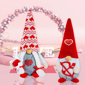 Detail of Valentine's Day gnome couple with heart-themed hats and festive props