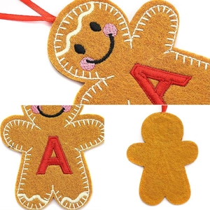 Gingerbread man felt ornament with red embroidery and ribbon for Christmas tree