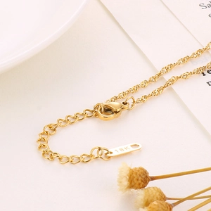 Macro shot of gold-plated 18K stainless steel necklace clasp and adjustable extender chain