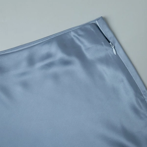 Detail of elegant satin skirt with smooth side invisible zipper and premium stitching