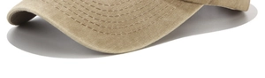 Detailed macro view showing the precise stitching on the washed khaki cotton baseball cap brim