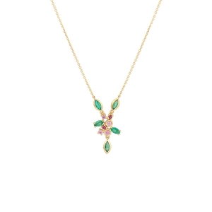 Close-up of gold hummingbird pendant with green and pink gemstones on an O-chain