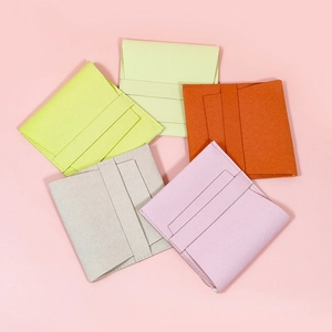 Minimalist microfiber envelope jewelry bags in five macaron colors on pink background