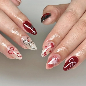 Deep red and cream bow press-on nails with silver stars and 3D pearls glossy finish