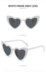 Detailed views of white heart-shaped sunglasses with grey lenses in front and side angles