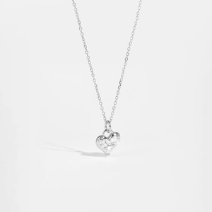 Close-up of S925 sterling silver heart pendant with three micro-set zircon stones