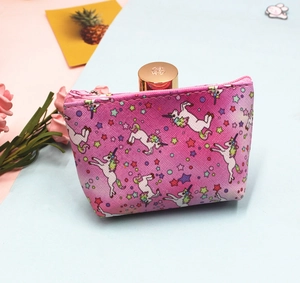 Detail of cute pink unicorn coin purse showing zipper closure and small storage capacity