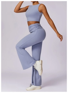Detail of lilac yoga set showing ruched high waistband and flare pants in matte fabric