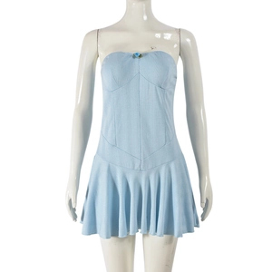 Macro shot of light blue jacquard tube dress with flower detail and ruffled hemline