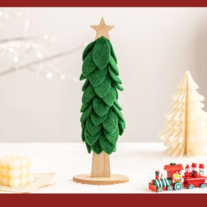 Close-up of a green felt Christmas tree with a wooden star and solid wood base stand