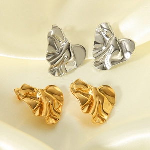 Textured 18K gold and silver heart earrings with irregular crumpled metal surface