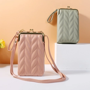 Detail showing quilted textures of mini phone bags in dusty pink and sage green finishes