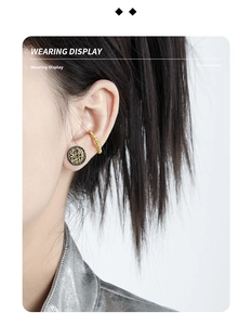 Close-up of S925 silver grid earring and gold ear cuff on a model wearing silver outfit