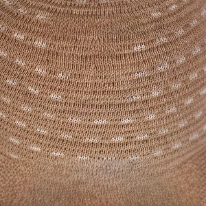 Close-up of brown linen knit bucket hat showing breathable mesh texture and fine stitching