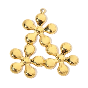 Detailed view of triple gold flower pendant with polished stainless steel finish