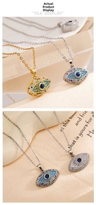 Detail of evil eye pendants with vibrant blue and red zircons on 18K gold plated chains