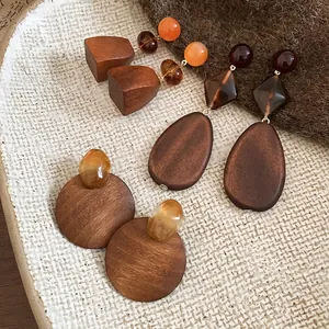 Retro geometric wooden resin earrings featuring walnut wood and amber teardrop pendants