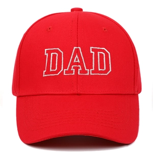 Detail of red cotton baseball cap featuring high-quality white DAD embroidery on the front