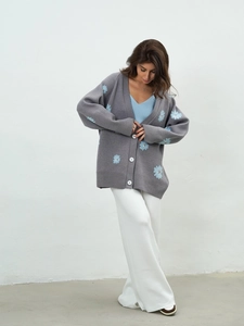 Gray oversized knit cardigan with light blue daisy embroidery and button-down front