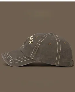 Detail of vintage baseball cap featuring HAN embroidery and decorative triple stitching