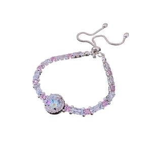 Silver bolo bracelet featuring colorful cubic zirconia and a large center crystal