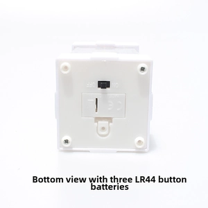 Detail view of lantern bottom showing on/off switch and LR44 battery compartment