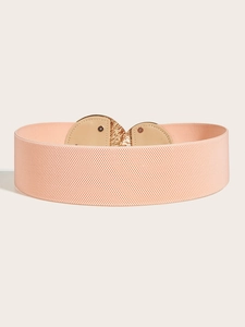 Macro detail of elastic wide belt with peach pink fabric and gold metal buckle